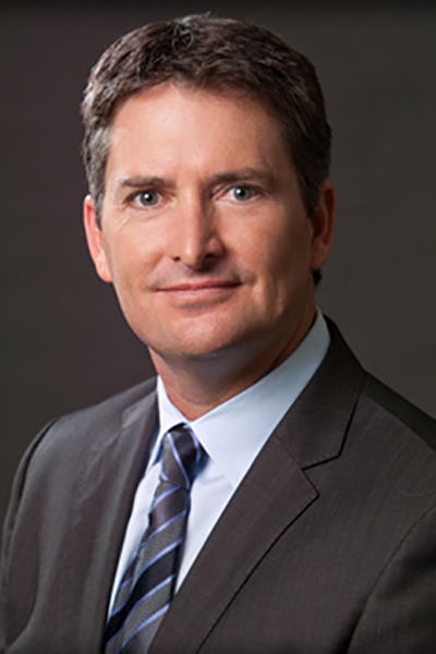 A man in suit and tie posing for the camera.